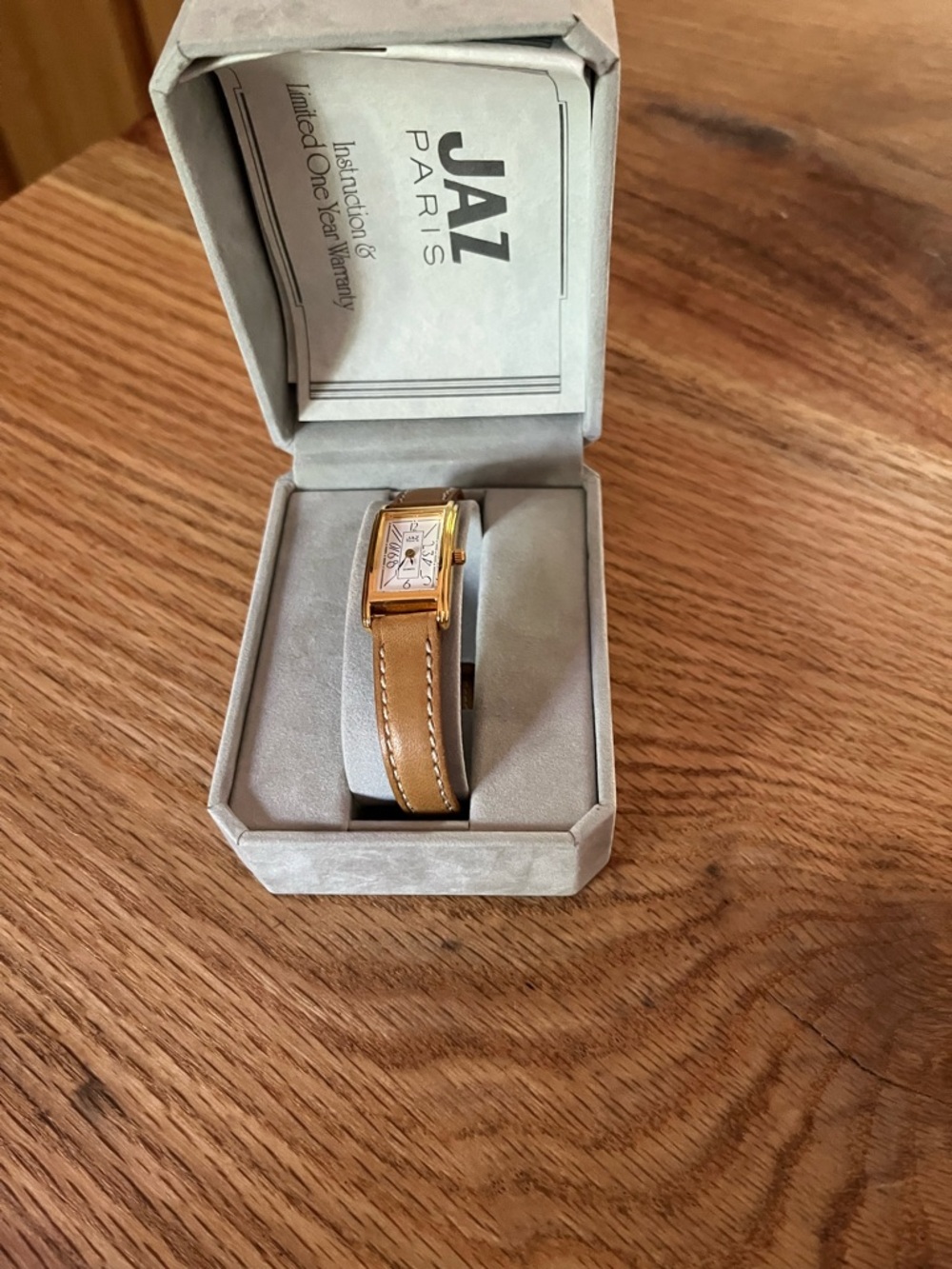 Vintage Women's Gold-Tone Rectangular Watch with Tan Leather Strap